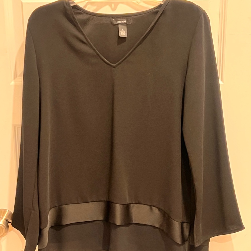 Black dress shirt that will never wrinkle. Flowy sleeves